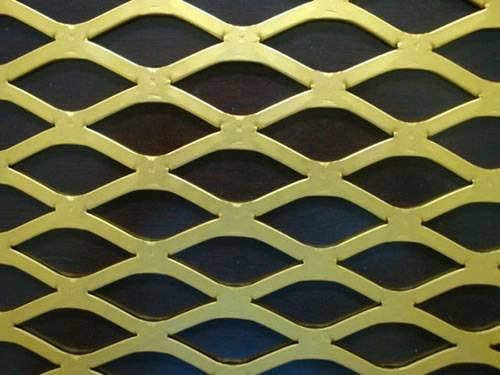 Flattened expanded metal brass mesh details with diamond holes.