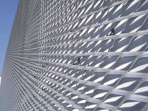 Galvanized expanded metal sheet with raised surface and diamond holes is used as facade.