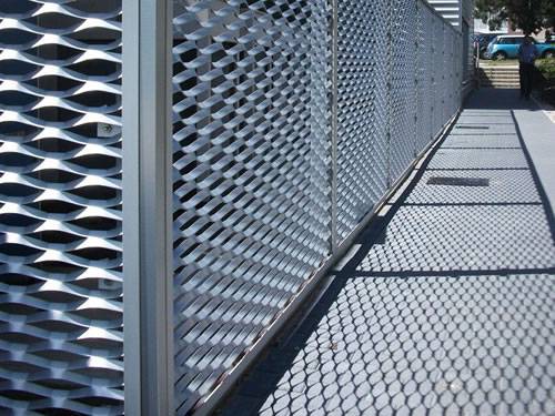 Expanded metal infill panels with galvanized surface are used for residential area fence.