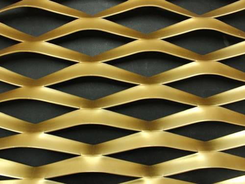 Raised expanded brass mesh details with diamond holes.